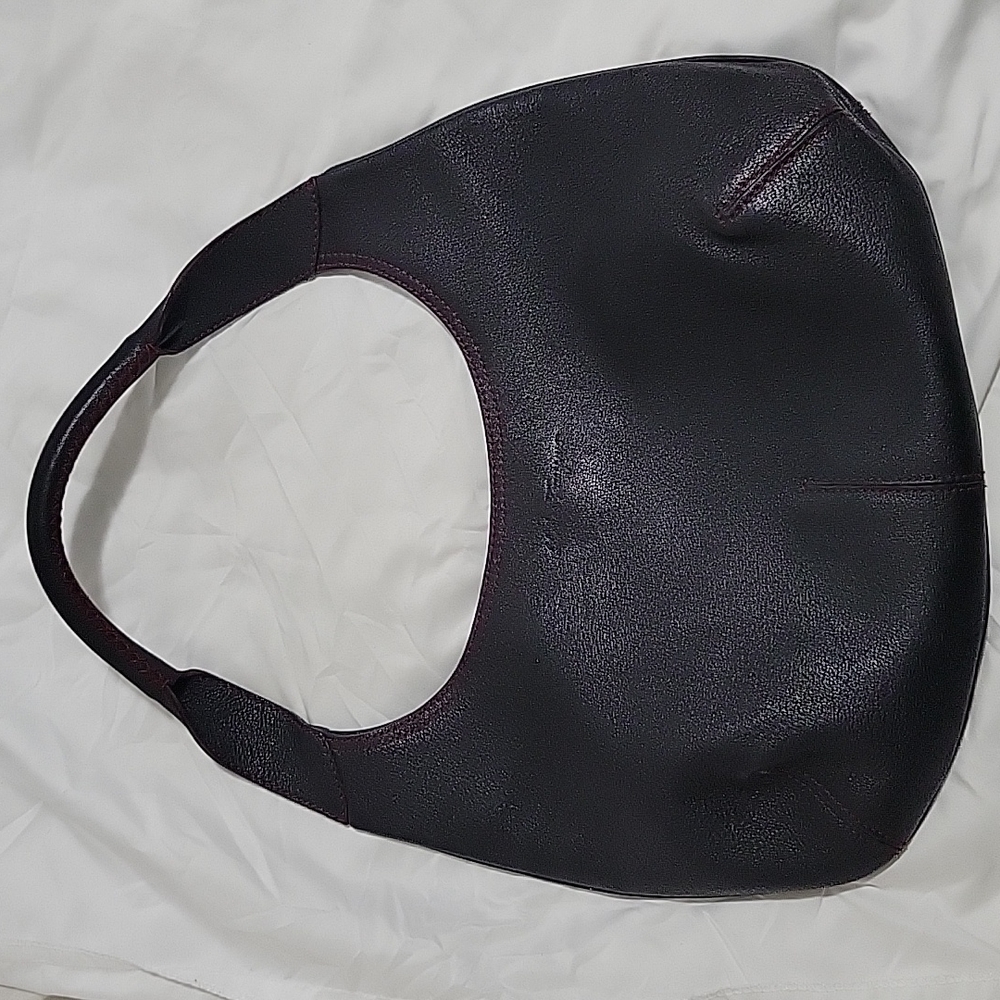 Salvatore Ferragamo black leather hobo bag.